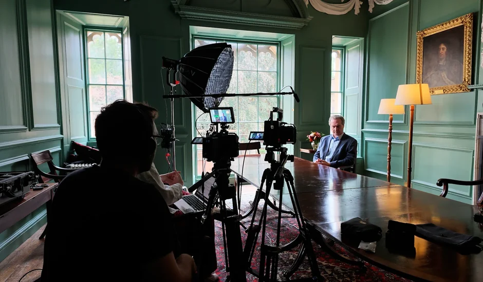 A surgeon being filmed for his website video